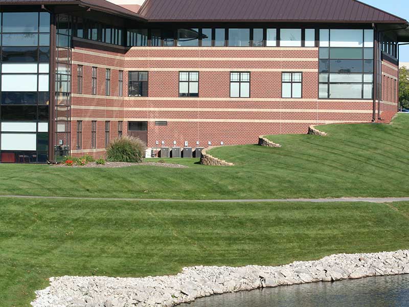 municipalities - office building on well manicured lawn near lake