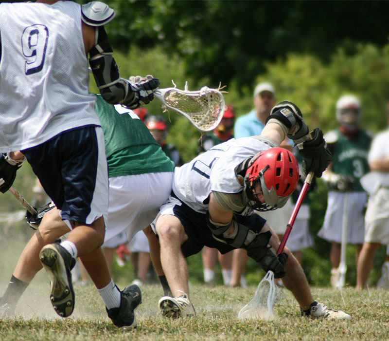 youth lacrosse players on sports fields