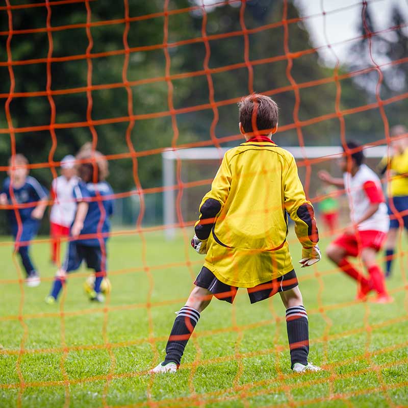 youth soccer goalie on sports fields