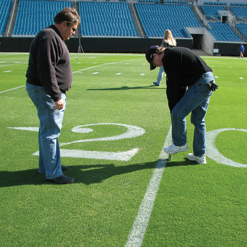 professionals testing soil on NFL sports fields